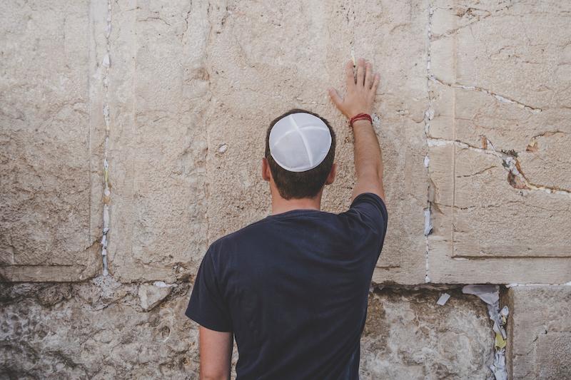 Man touching wall